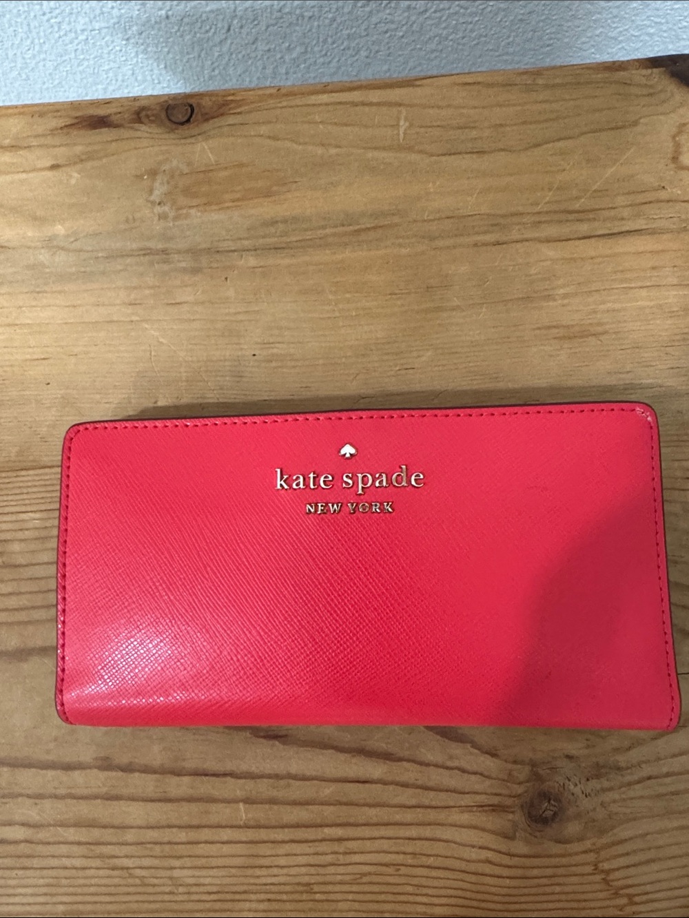 kate spade coral red saffiano continental wallet with gold logo